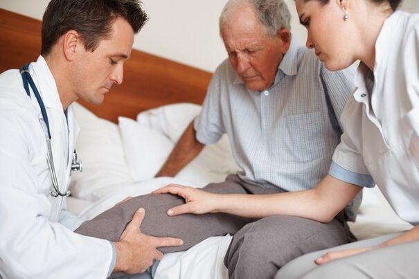 Doctor examining a patient's knee